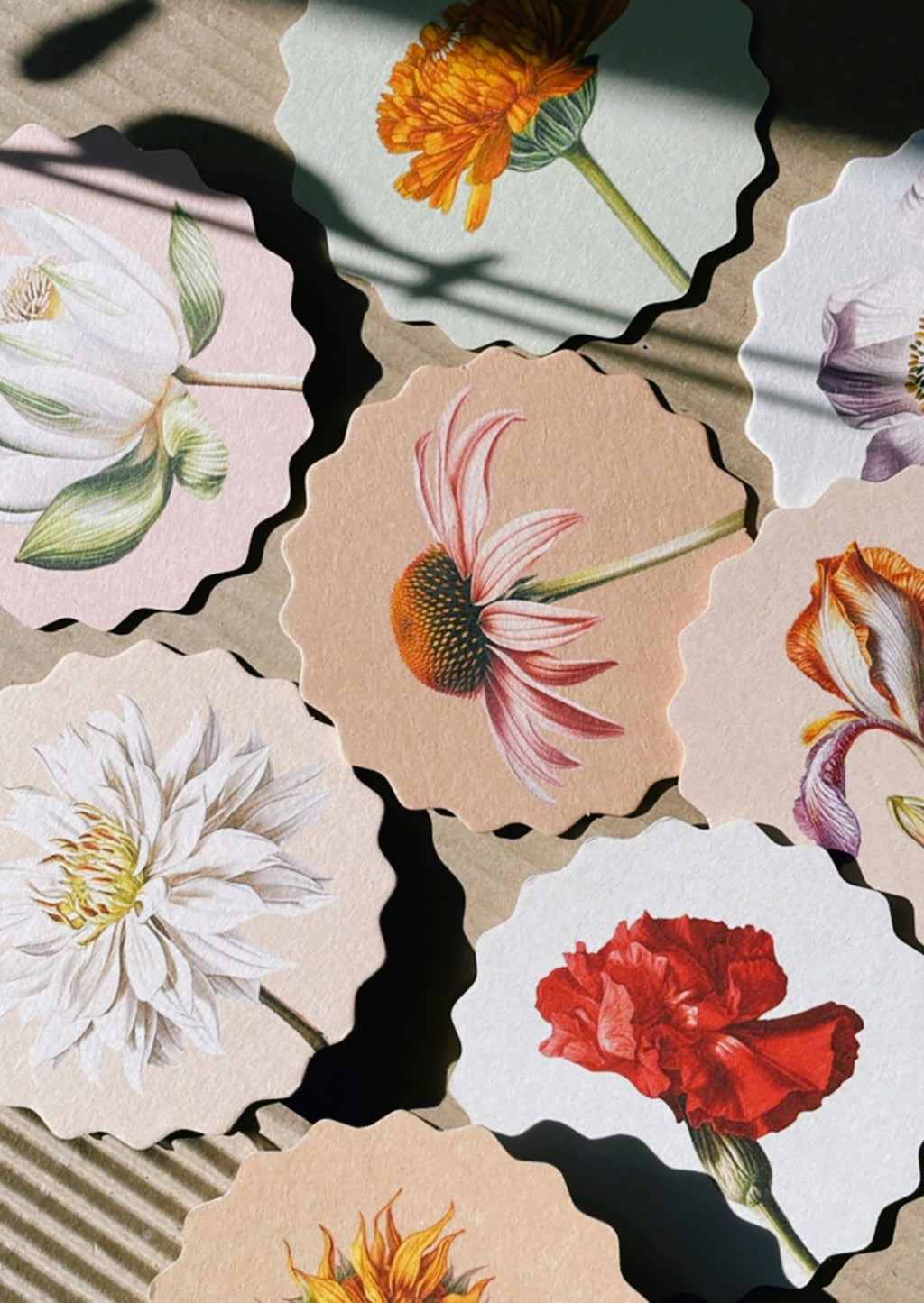Flowers: A set of scalloped edge paper coasters with 10 different flower prints.