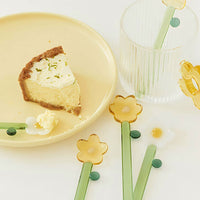 2: Yellow and white flower spoons.