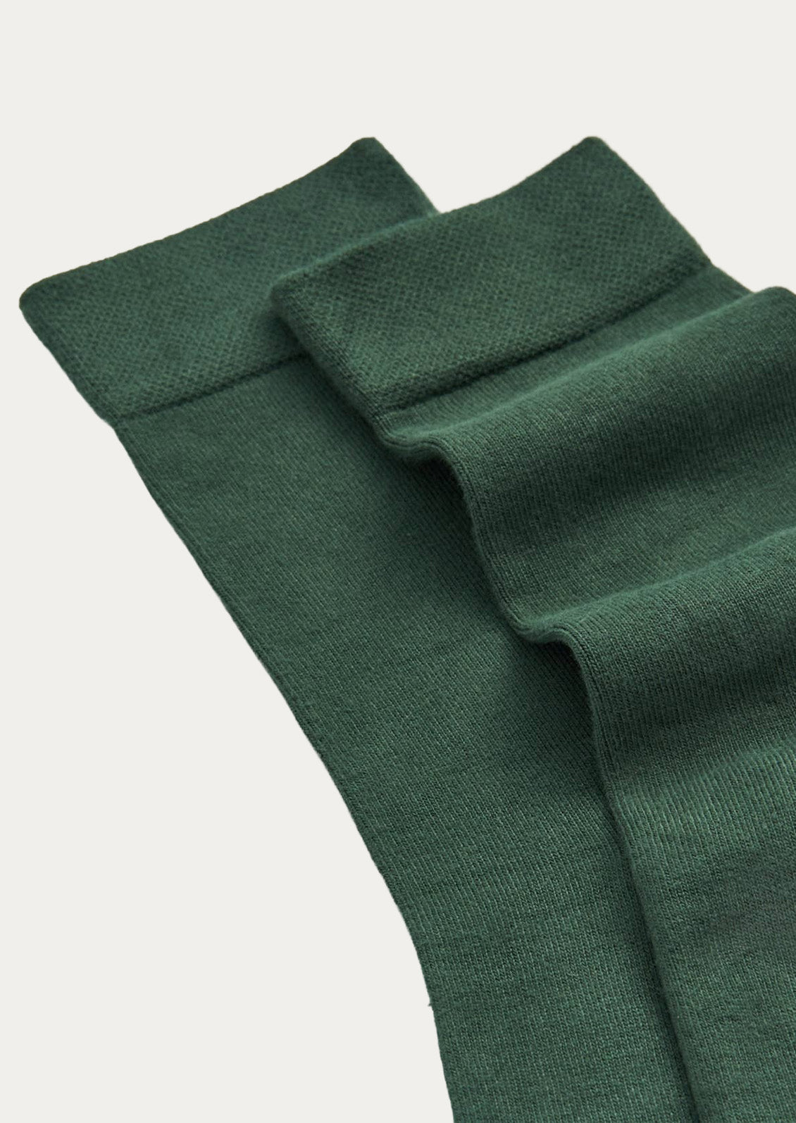 A pair of forest green bamboo blend calf-length crew socks.