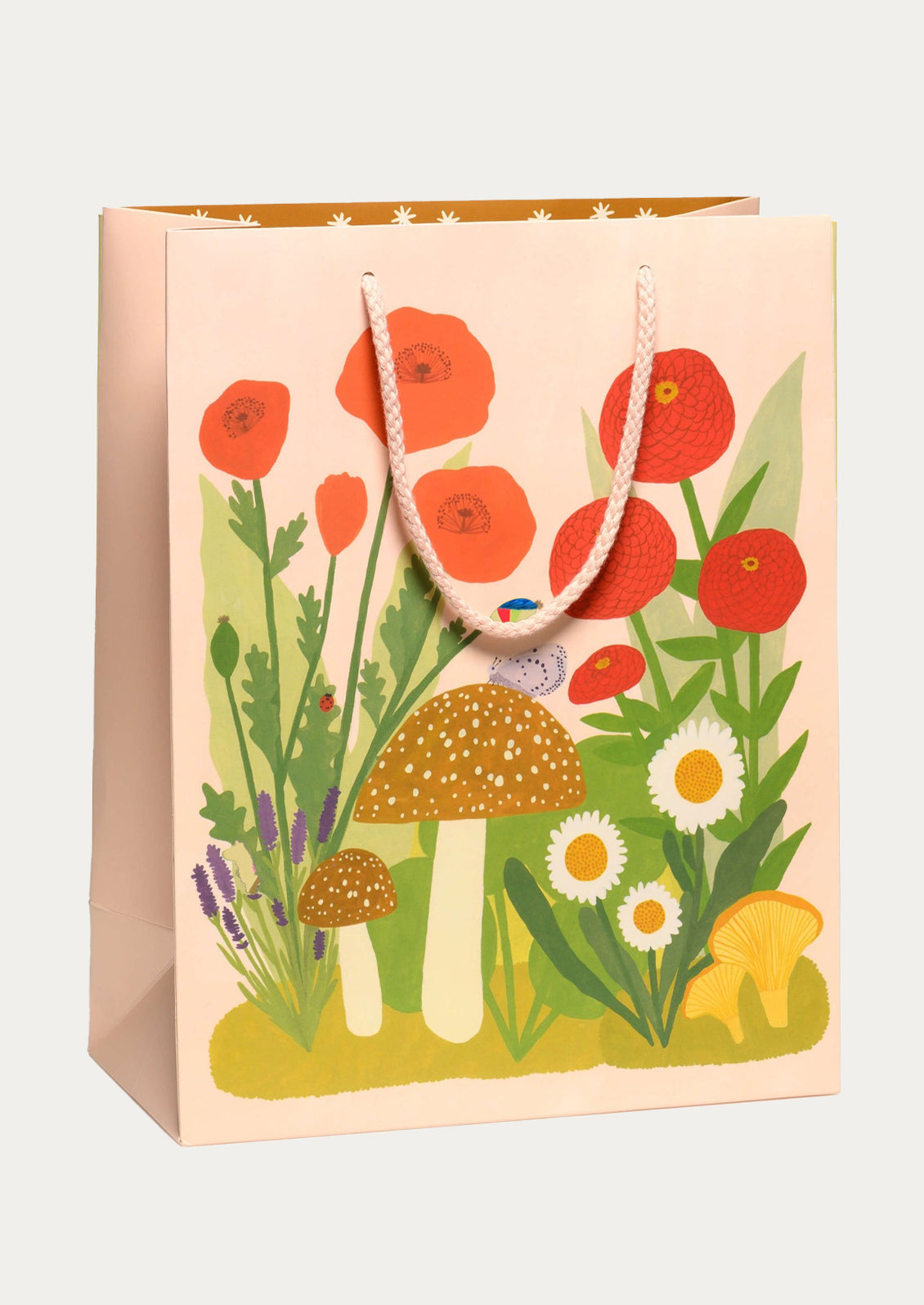 Gift bag with floral and mushroom design on a white background