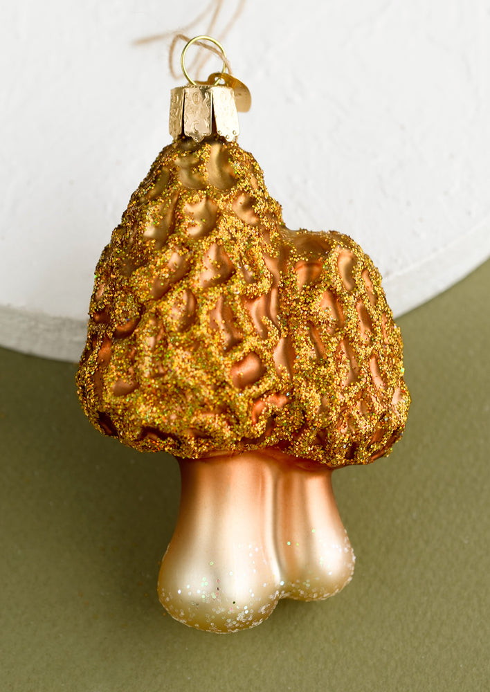 1: A glass holiday ornament of morels mushrooms.