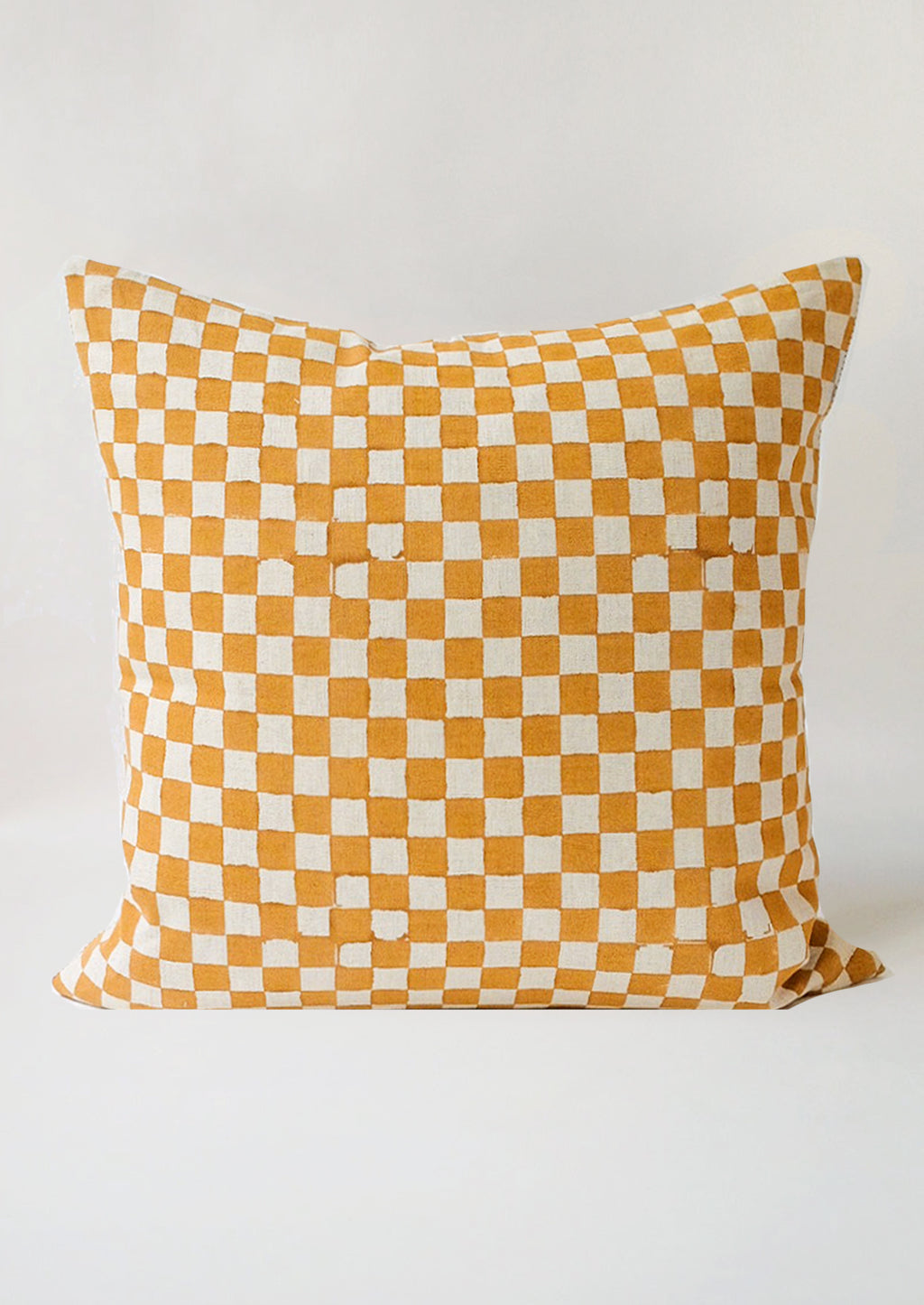 2: The reverse side of a square pillow with mustard checker print.