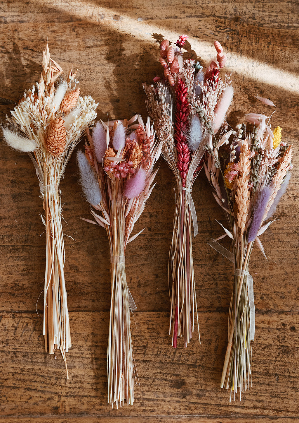 1: Dried floral bundles in assorted colors.