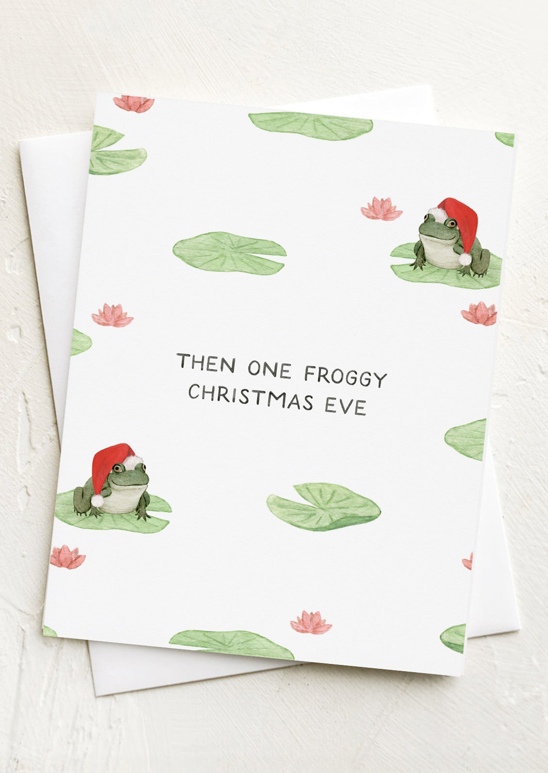 A christmas card with illustration of frogs wearing santa hats, text reads "Then one froggy Christmas eve".