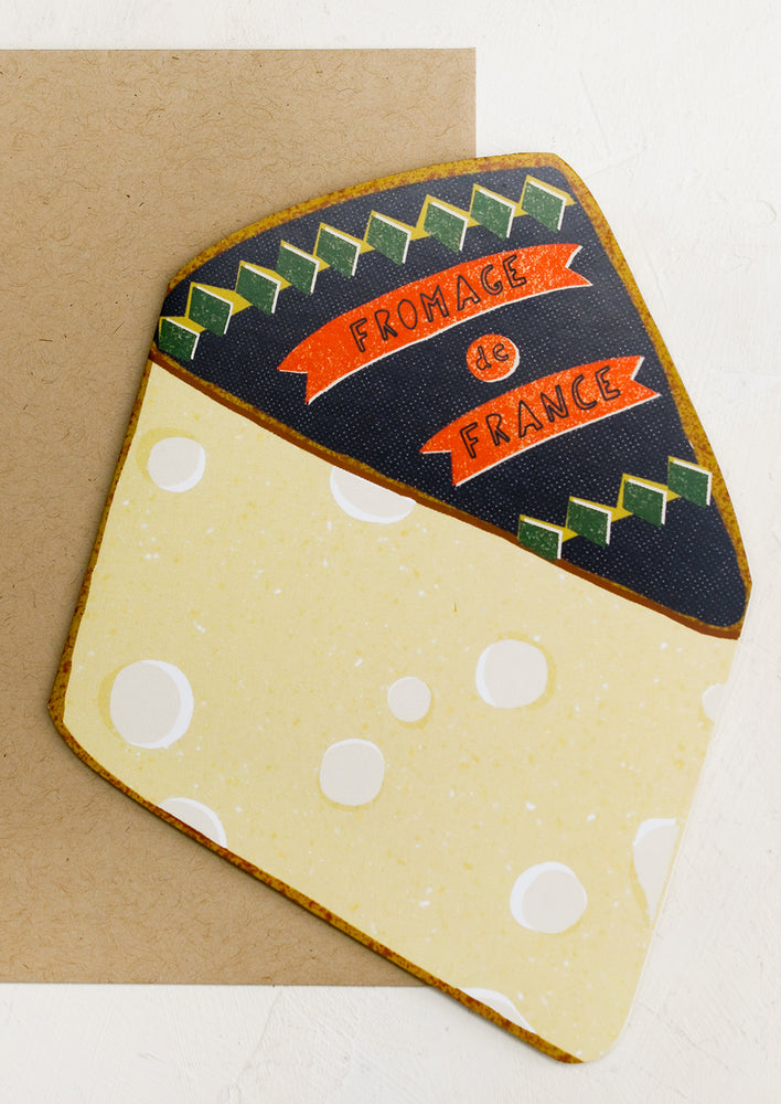 A diecut card in the shape of a wedge of cheese, reads "Fromage de France".