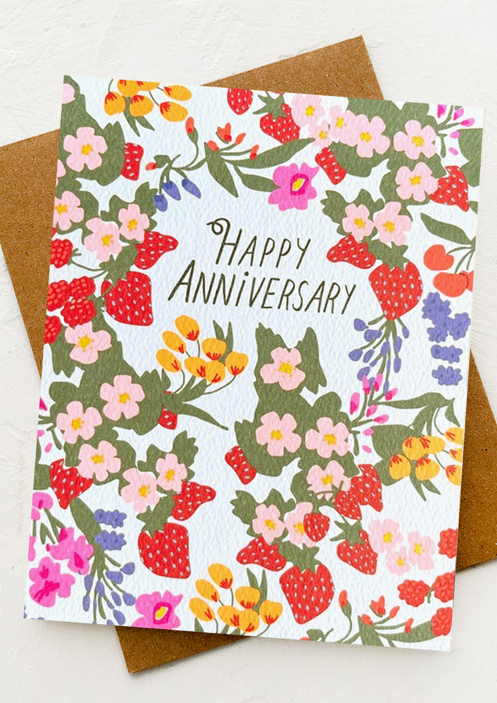 A fruit and flower print card reading "Happy Anniversary".