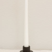 Wide / Charcoal: A short and wide fluted concrete taper candle holder in charcoal.