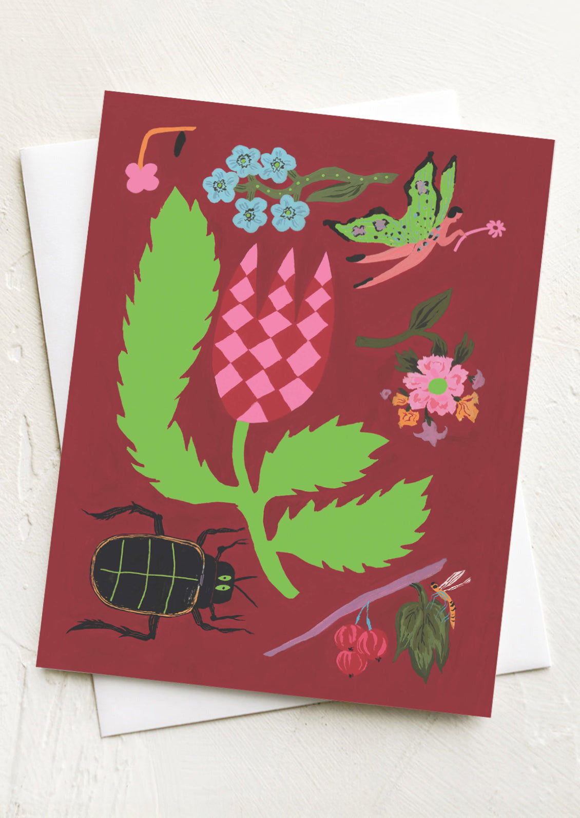 Greeting card with nature-themed illustrations on a red background