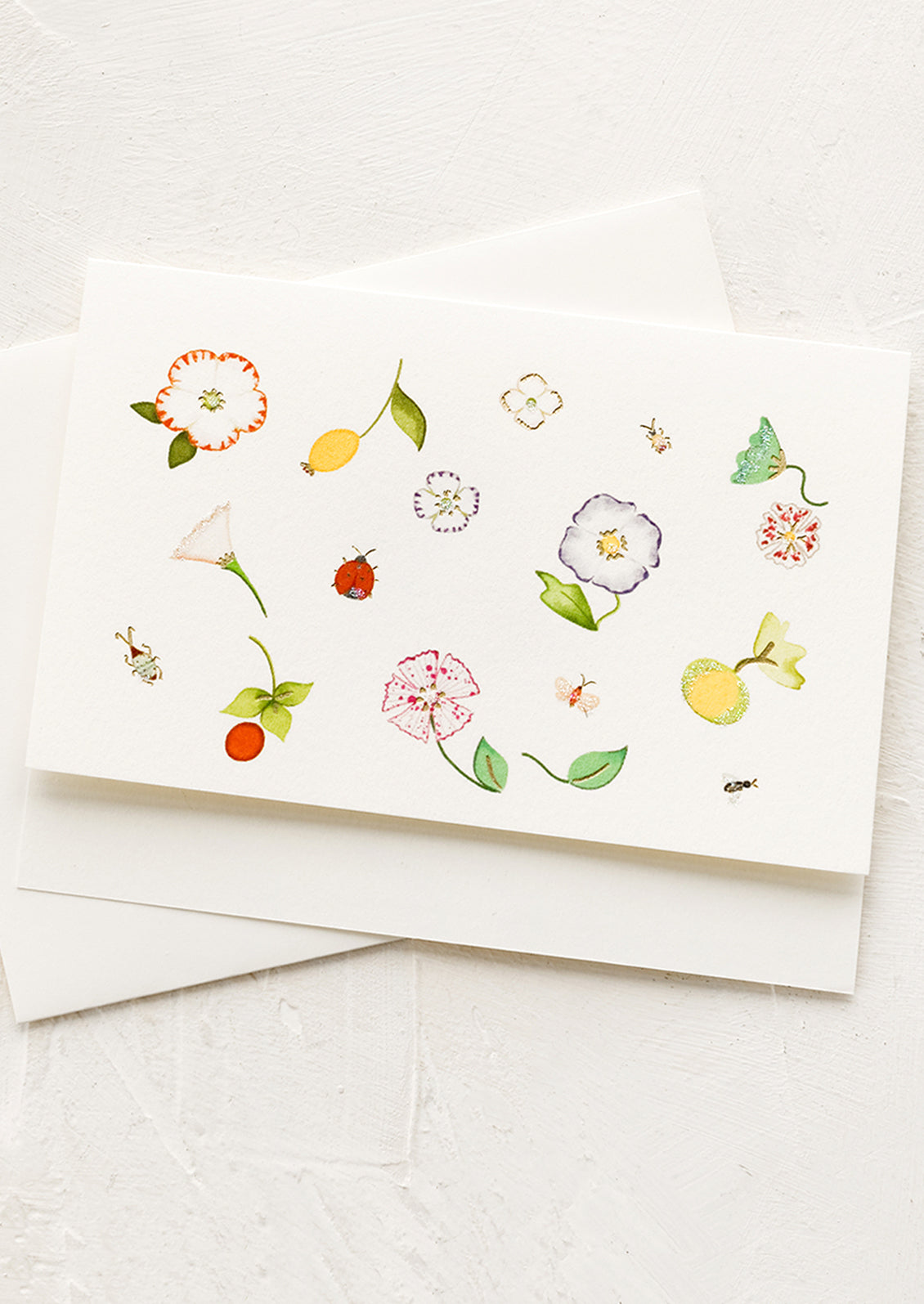 A greeting card with garden botanical illustrations.