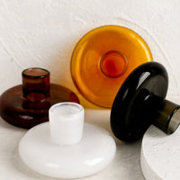 1: Glass taper candle holders in assorted colors.