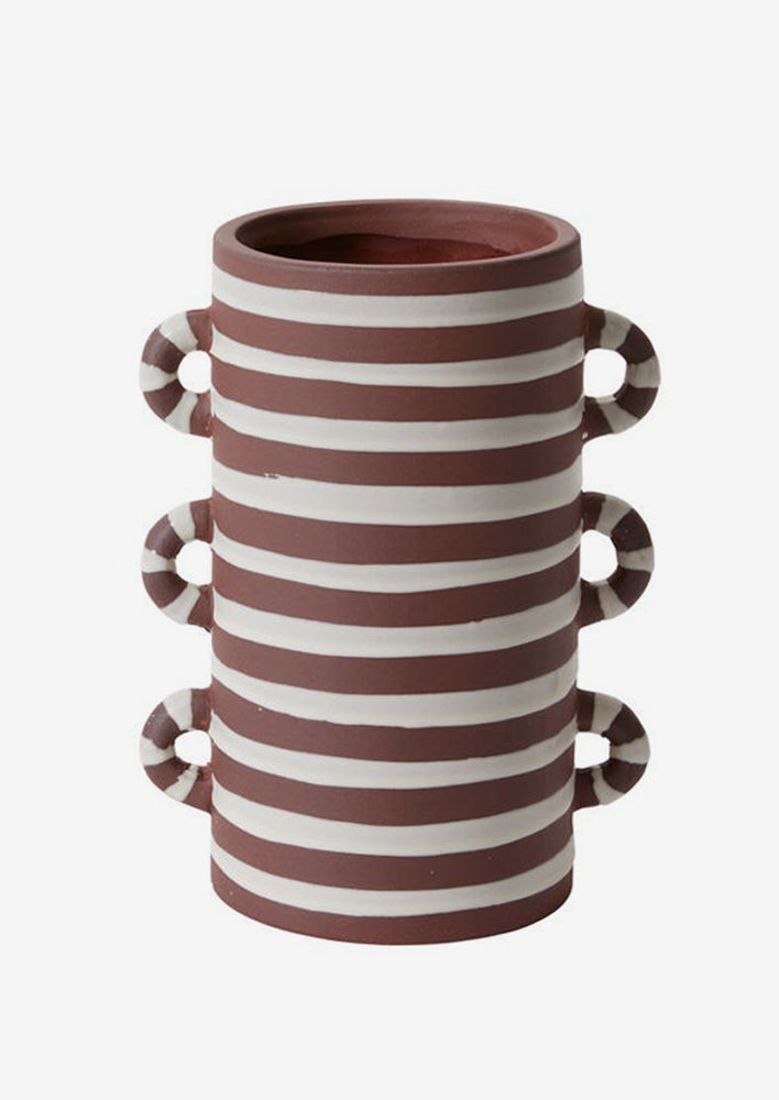 A brown and white ceramic vase with loopy decorative side handles.