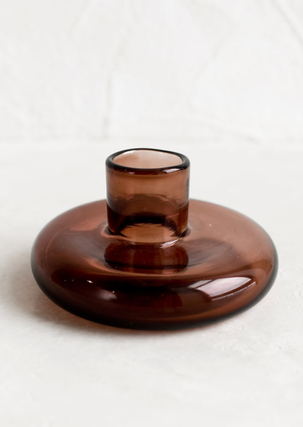 Rosewood: A glass taper candle holder in rosewood.