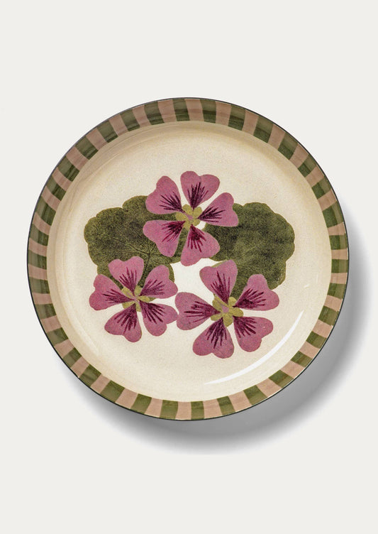 Enamel plate with floral design on a white background
