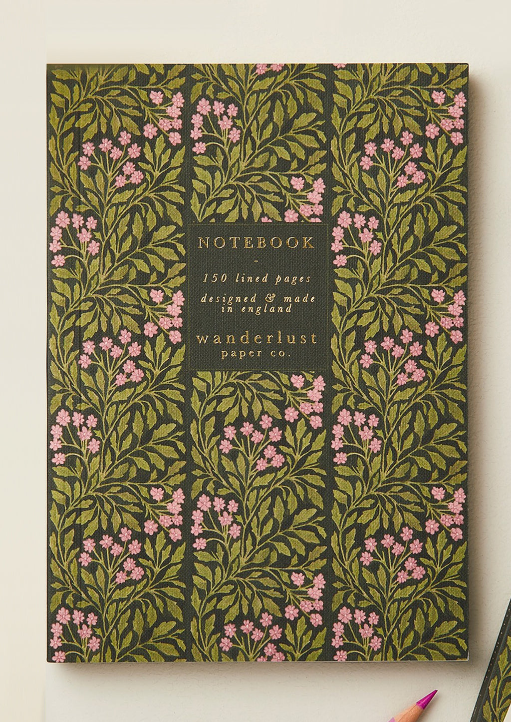 Geranium Flora: A green and pink floral print notebook.
