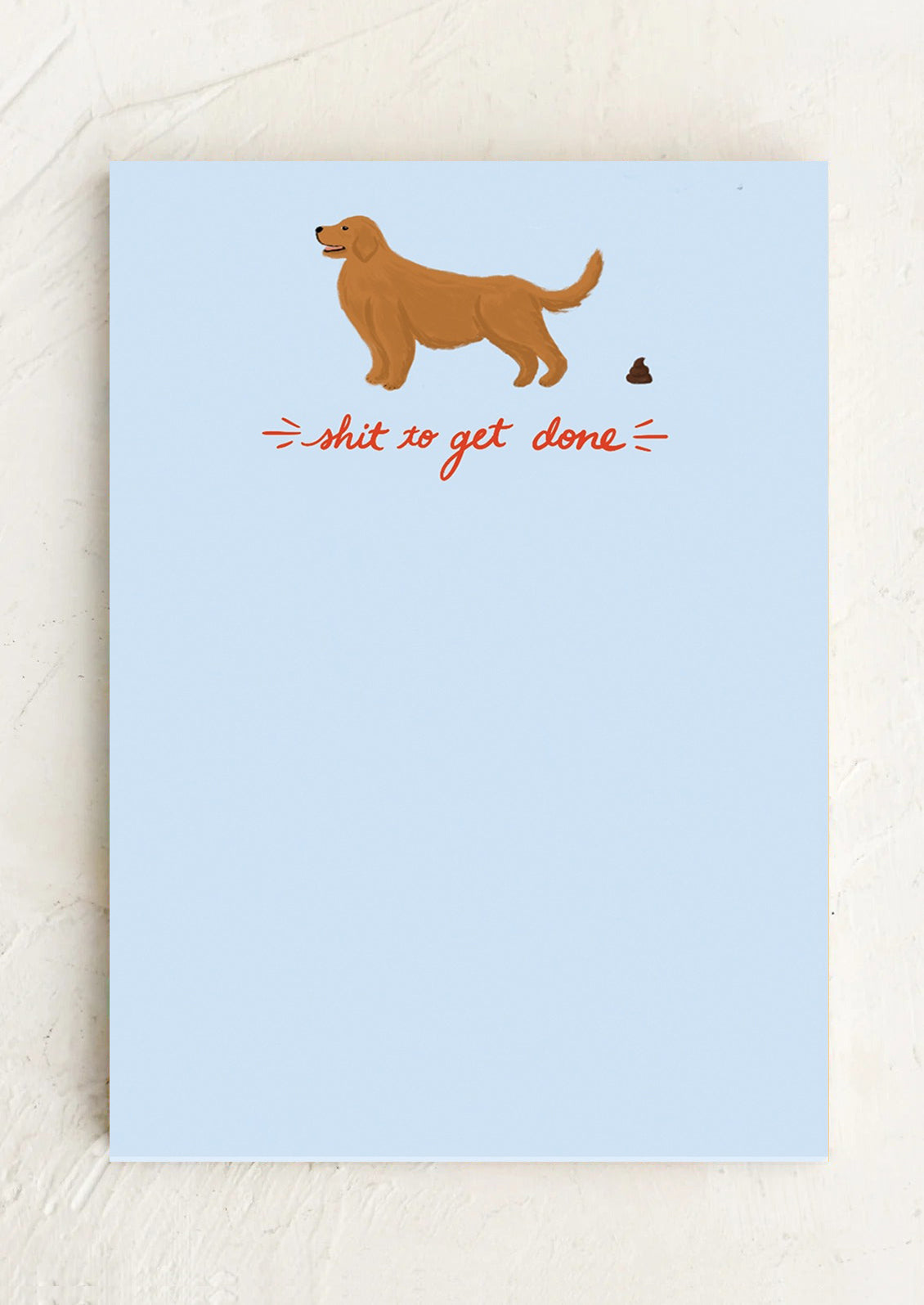 Notepad with a dog illustration and text on a light blue background