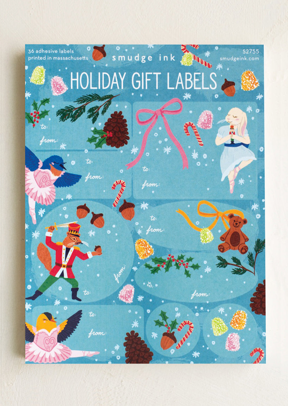 Pack of holiday gift labels with colorful illustrations on a blue background