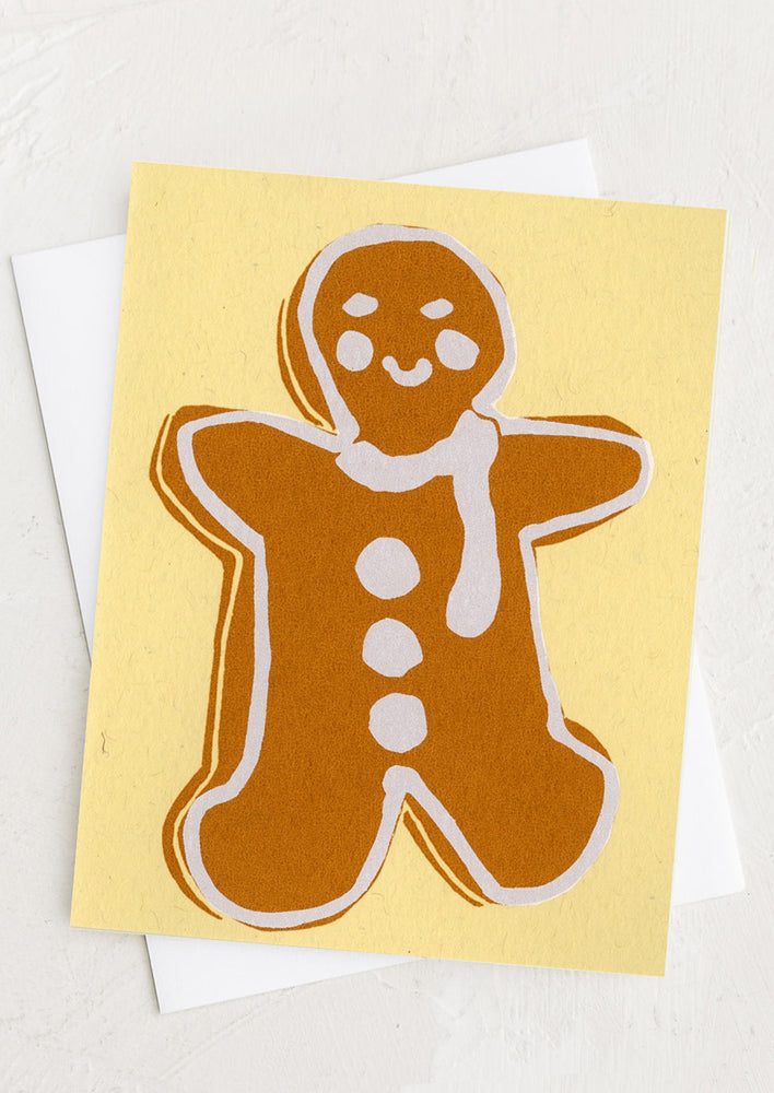 A silk screened card with gingerbread man design.