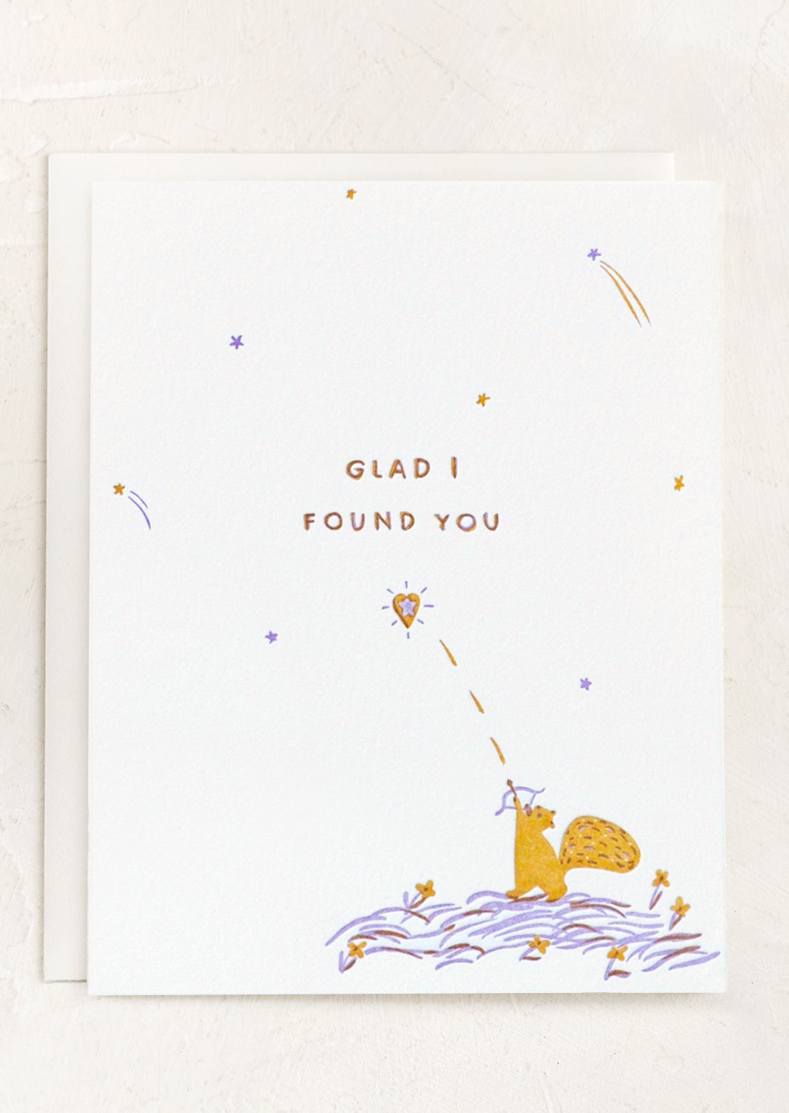 A card with illustration of squirrel shooting a heart arrow, text reads "Glad I found you".
