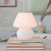 3: A white art glass table lamp with white/clear spiral pattern.