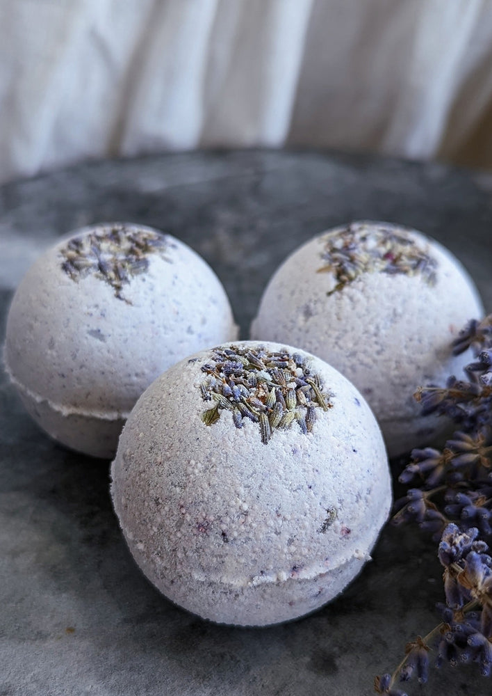 Sweet Lavender: Purple bath bombs with lavender buds.