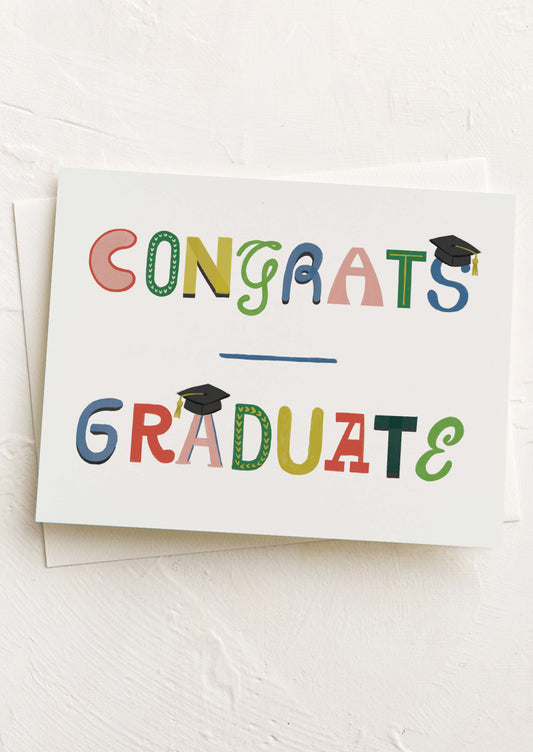 Graduation-themed card with colorful text on a white background