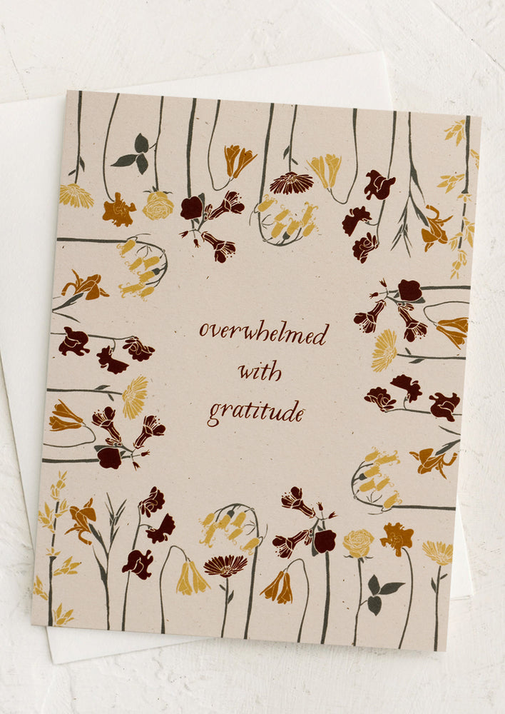 A floral print card reading "Overwhelmed with gratitude".