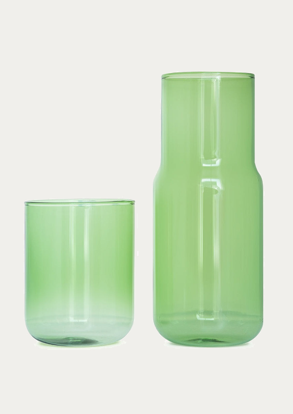 A stackable carafe and cup in transparent green color.