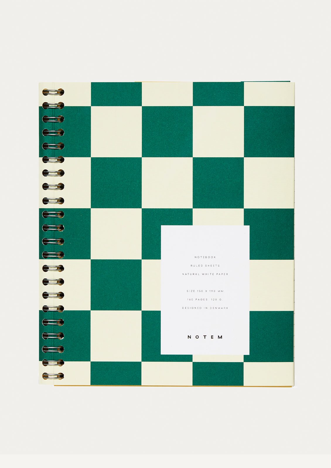 Checkered notebook with a white label on a white background