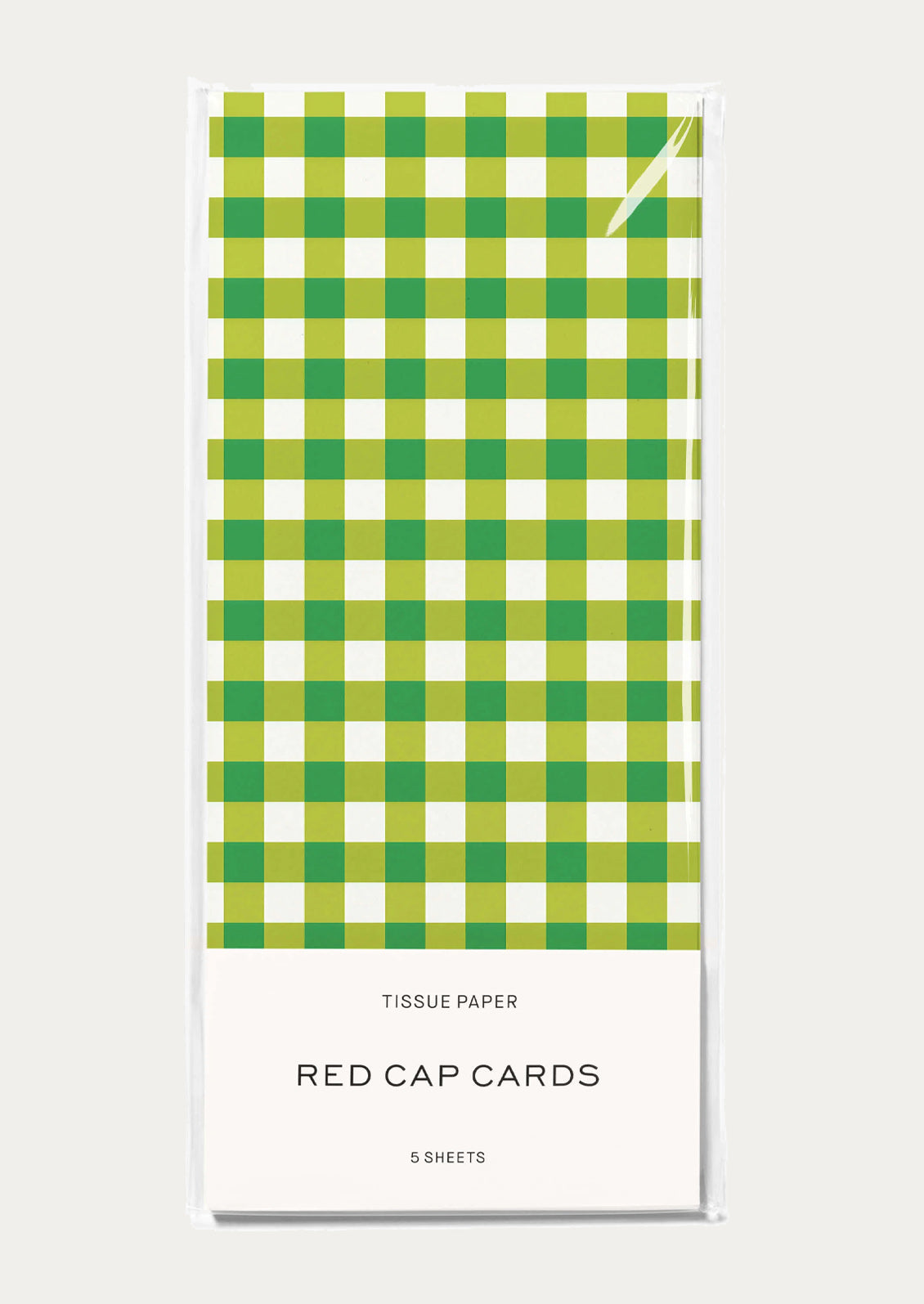 A pack of tissue paper featuring a green and white gingham checkered pattern.