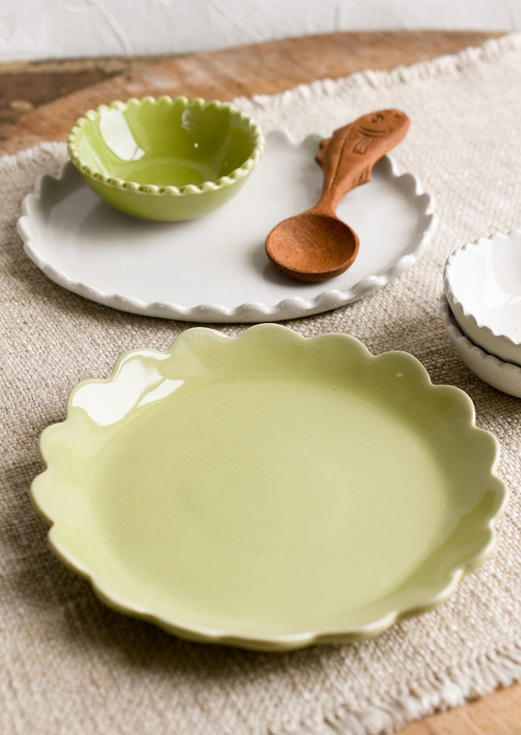2: A tableware scene of assorted ceramics in green and white.