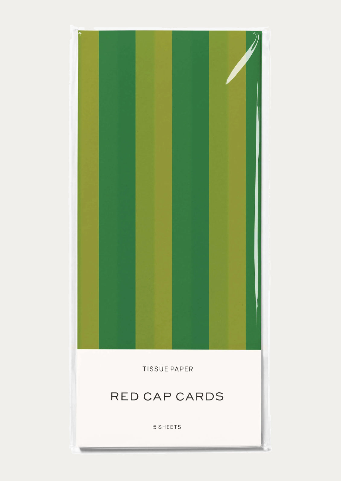 A pack of tissue paper with vertical green and olive stripes.