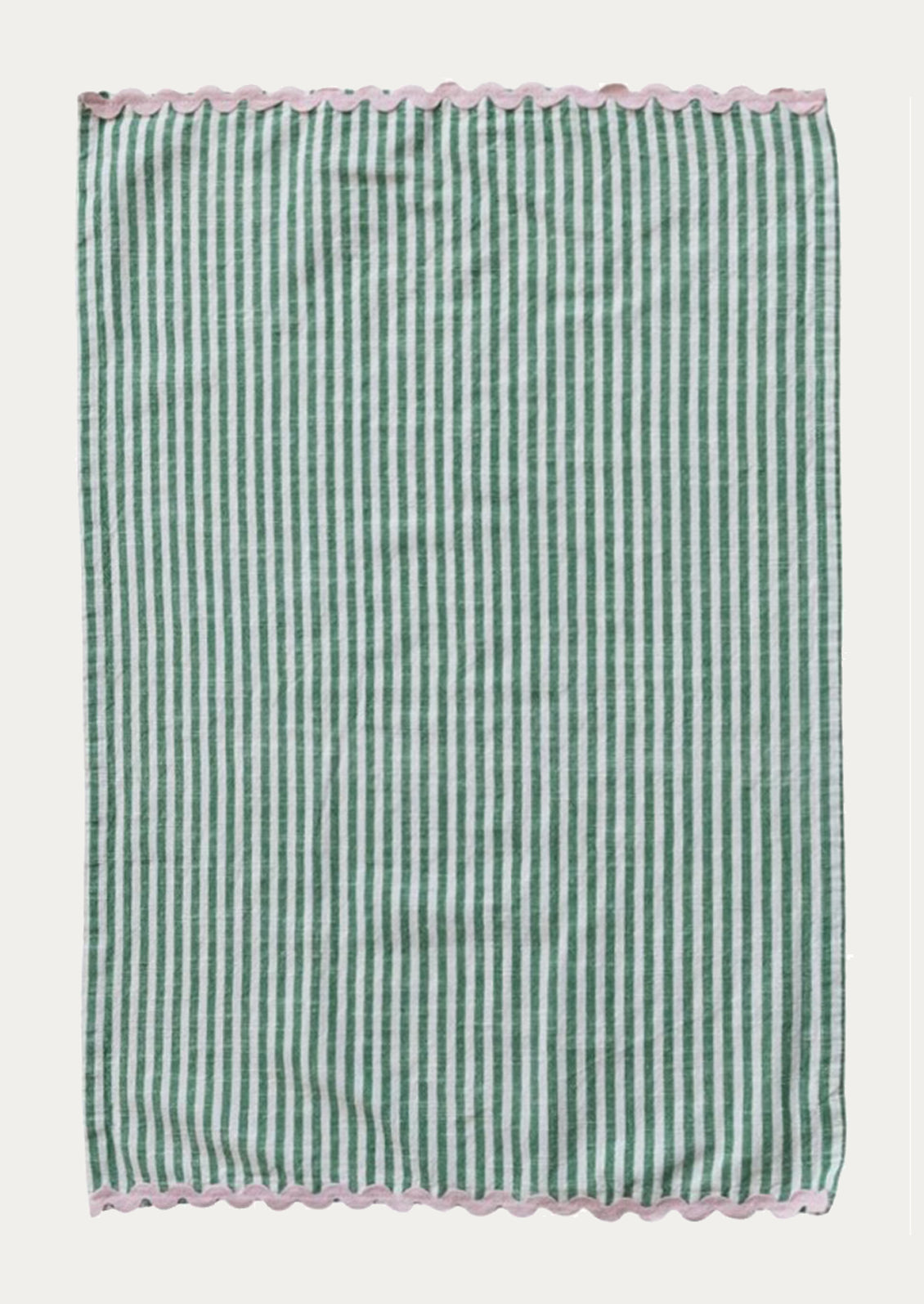 A green and white striped tea towel with pink ric rac trim at top and bottom.