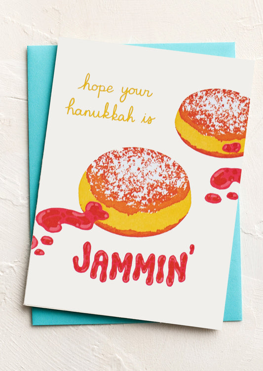A card with illustration of jelly donuts, text reads "Hope your Hanukkah is Jammin".