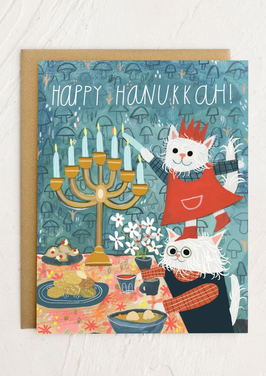 Hanukkah card with cats and a menorah on a blue background