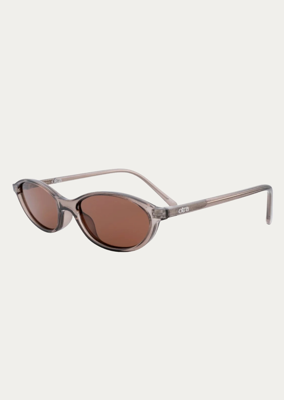 A pair of rounded cat eye sunglasses with a transparent olive frame and brown lenses.
