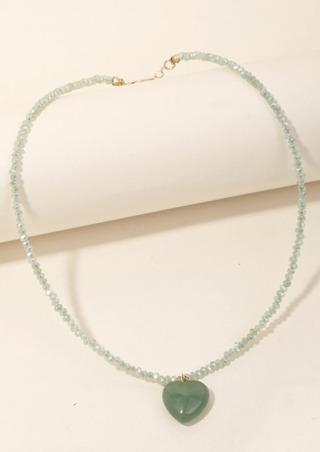Jade Multi: A mint green beaded crystal necklace with jade stone heart charm.