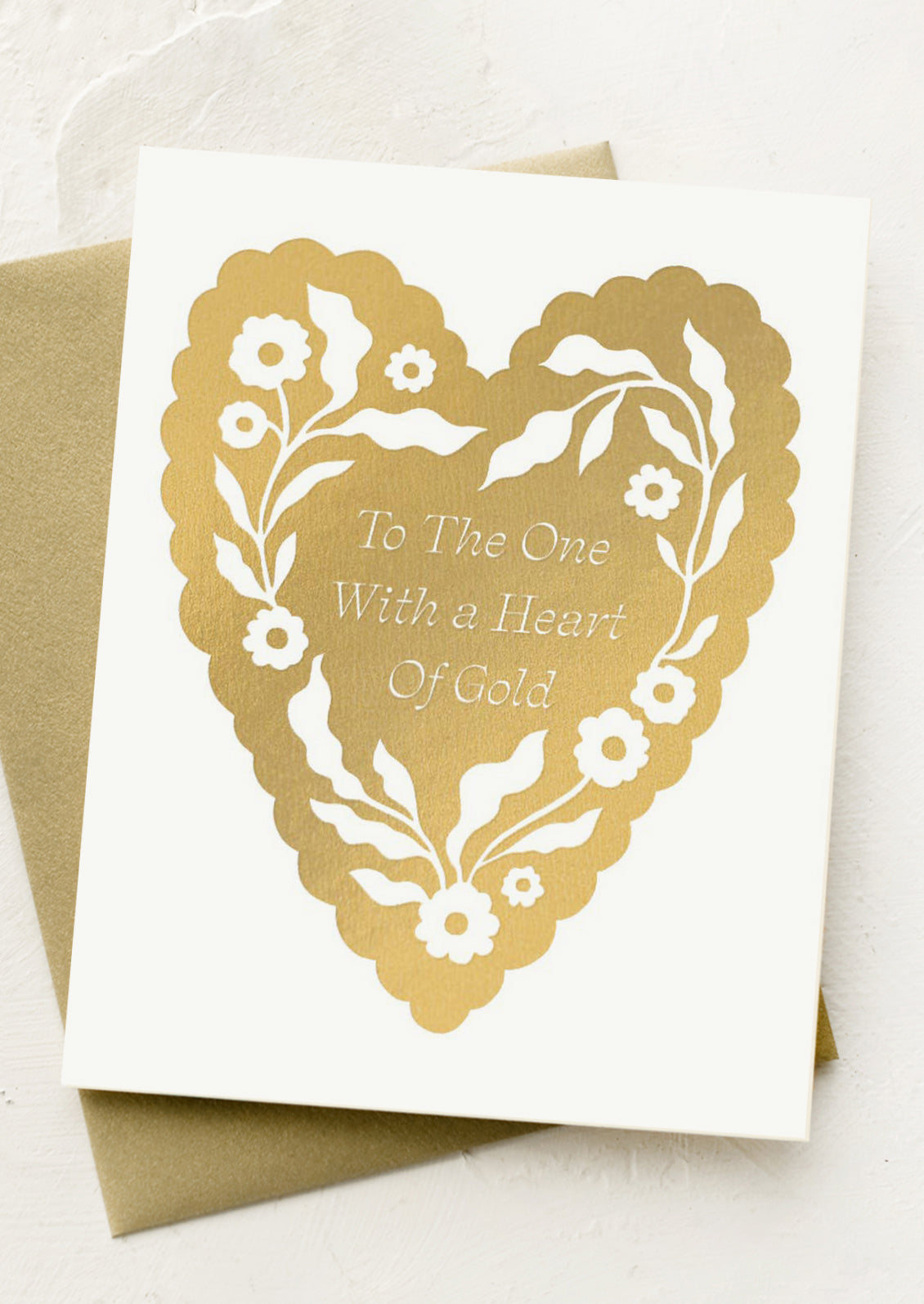 Greeting card with gold heart design and text on a white background
