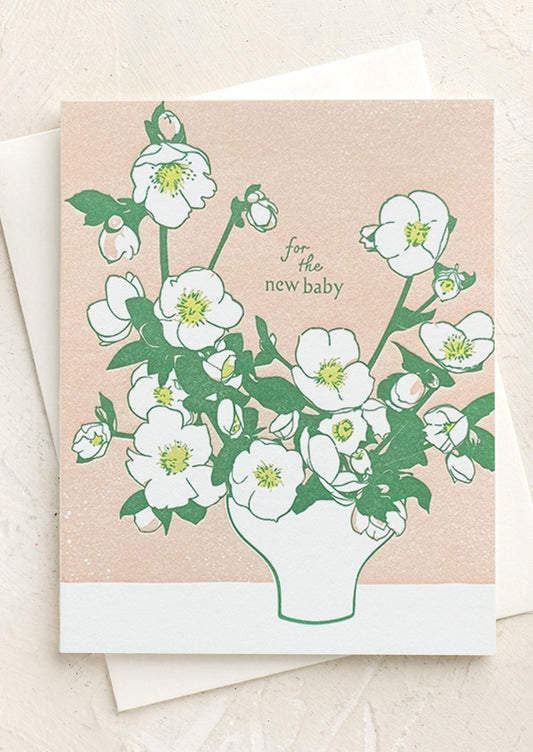 A card with image of hellebore flowers in a vase, text reads "For the new baby".