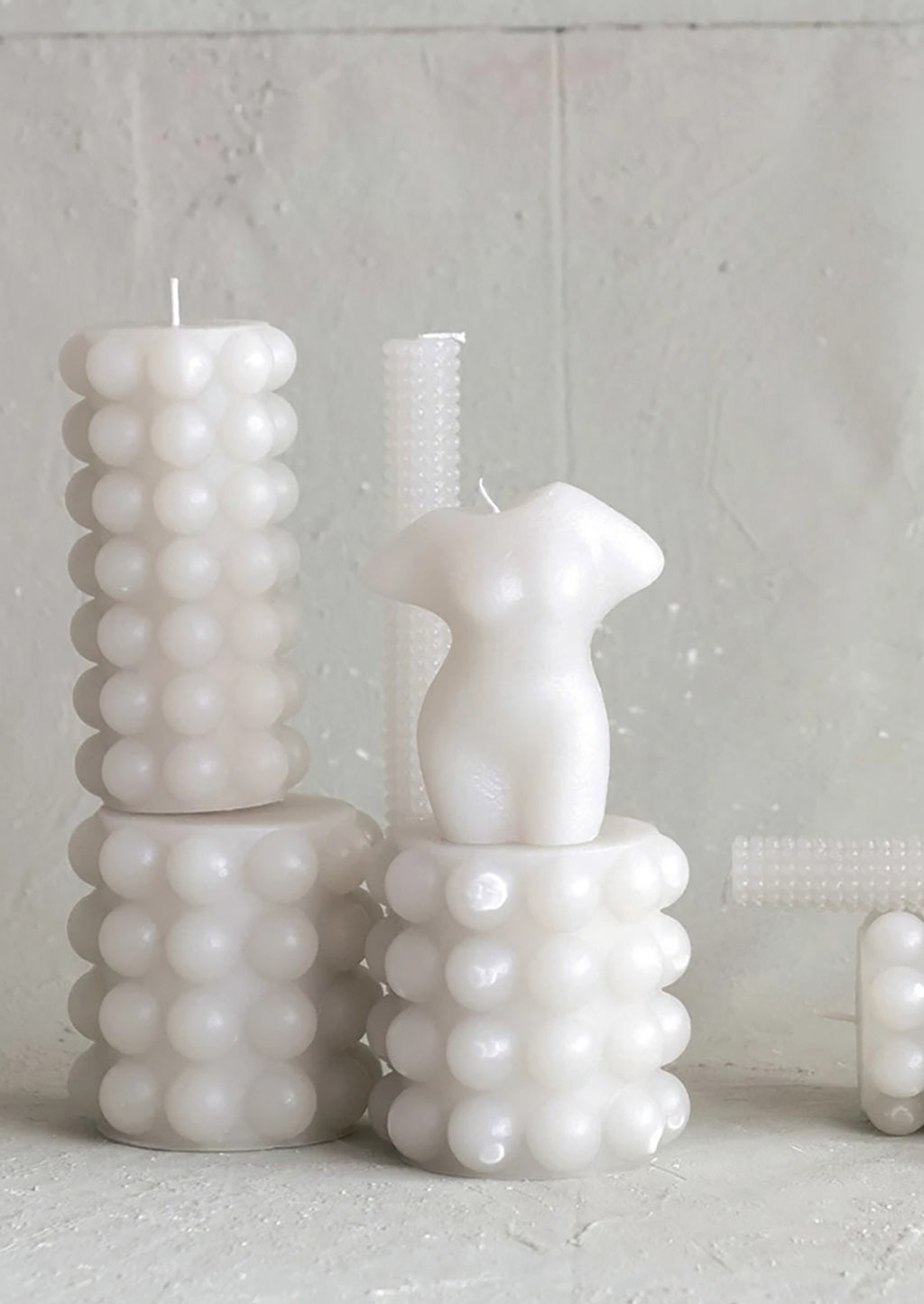 2: Assorted hobnail texture candles in oyster grey color.