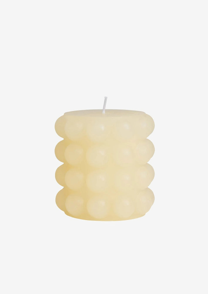 Short / Buttermilk: A buttermilk colored hobnail texture pillar candle in short.