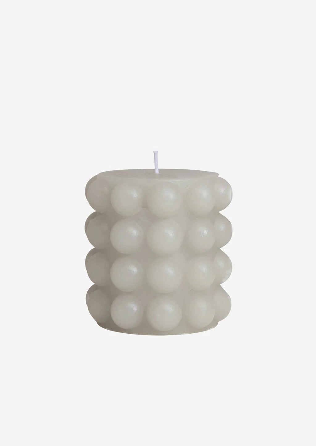 Short / Oyster: An oyster gray hobnail texture pillar candle in short.