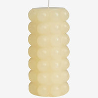 Tall / Buttermilk: A buttermilk colored hobnail texture pillar candle in tall.