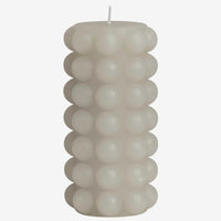 Tall / Oyster: An oyster gray hobnail texture pillar candle in tall.