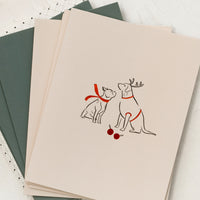 3: A card with illustration of two dogs wearing red scarves.