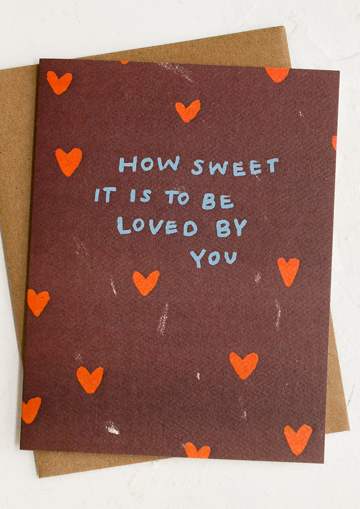 A heart print card reading "How sweet it is to be loved by you".