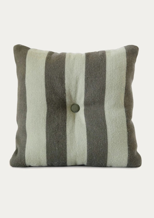 A striped pillow in mint and grey green with tufted button detail at center.