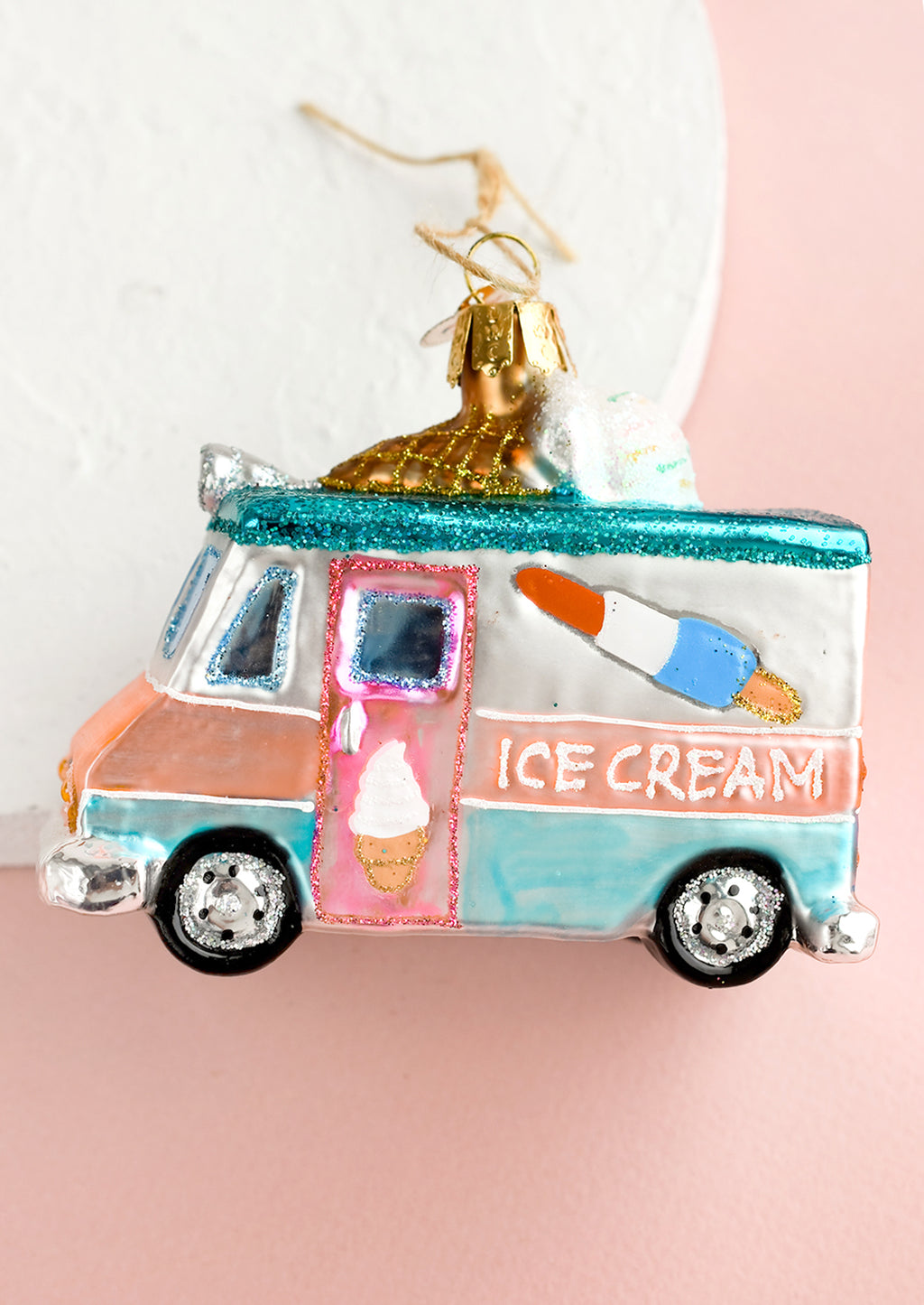 2: A holiday glass ornament of an ice cream truck.