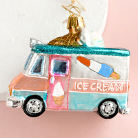 2: A holiday glass ornament of an ice cream truck.