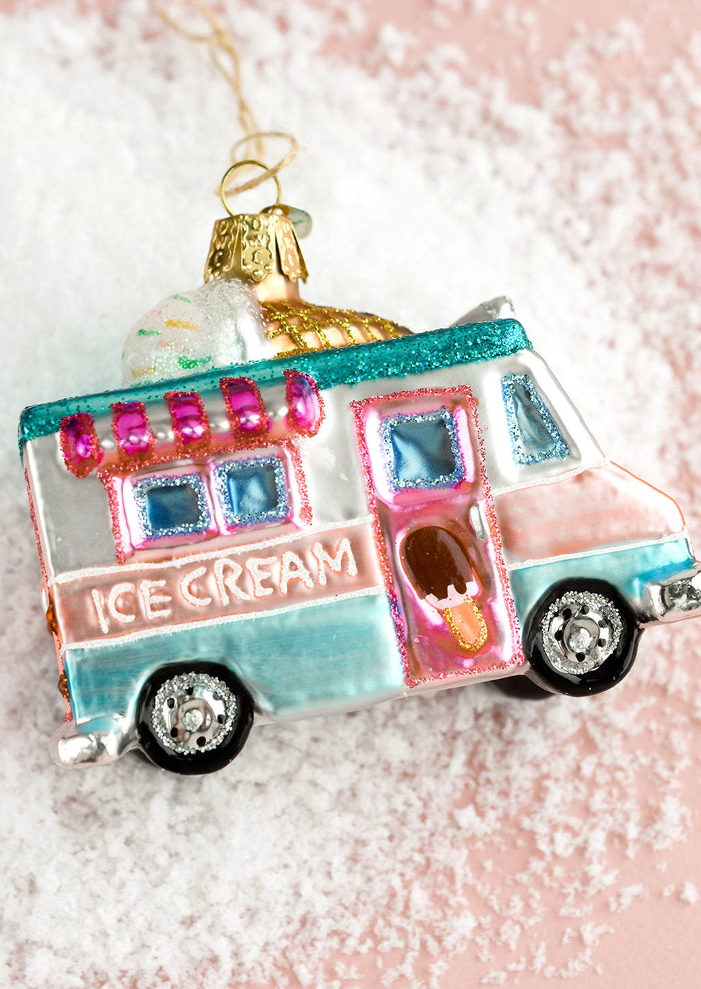 1: A holiday glass ornament of an ice cream truck.