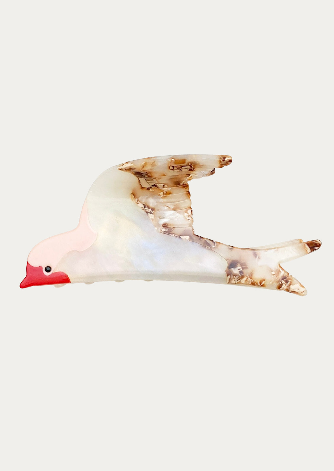 A hair claw clip in the shape of a swallow